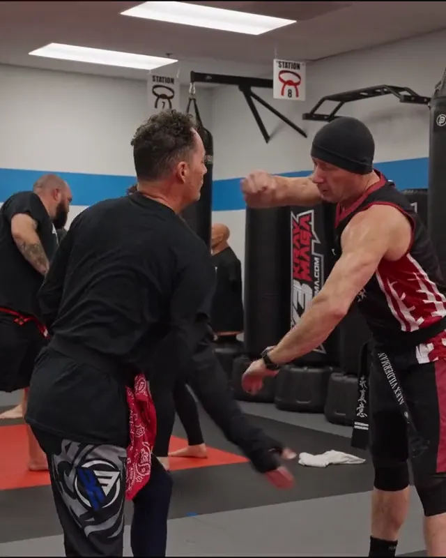Two teens in gloves drilling punches and blocks during Krav Maga training at K3 Martial Arts in Roseville